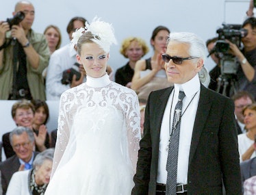 PARIS, FRANCE - JULY 05: Fashion designer Karl Lagerfeld and the bride walk the runway during the Ch...