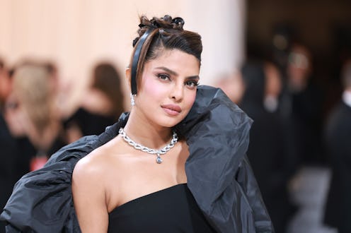 Priyanka Chopra at the 2023 met gala wearing an updo with hair bow