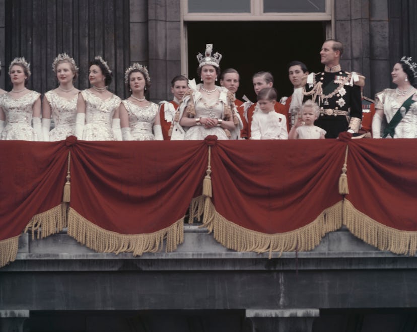 Queen Elizabeth II and the Duke of Edinburgh wave at the crowds from the balcony of Buckingham Palac...