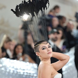 Florence Pugh attends The 2023 Met Gala Celebrating "Karl Lagerfeld: A Line Of Beauty" in a white cu...