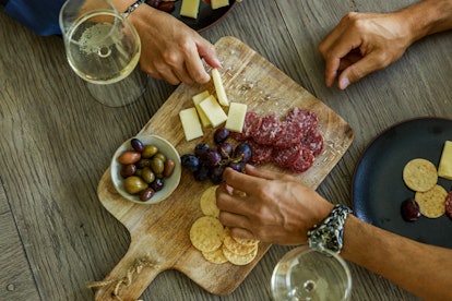 Two glasses of wine and a cheese plate: the Single Girl Supper