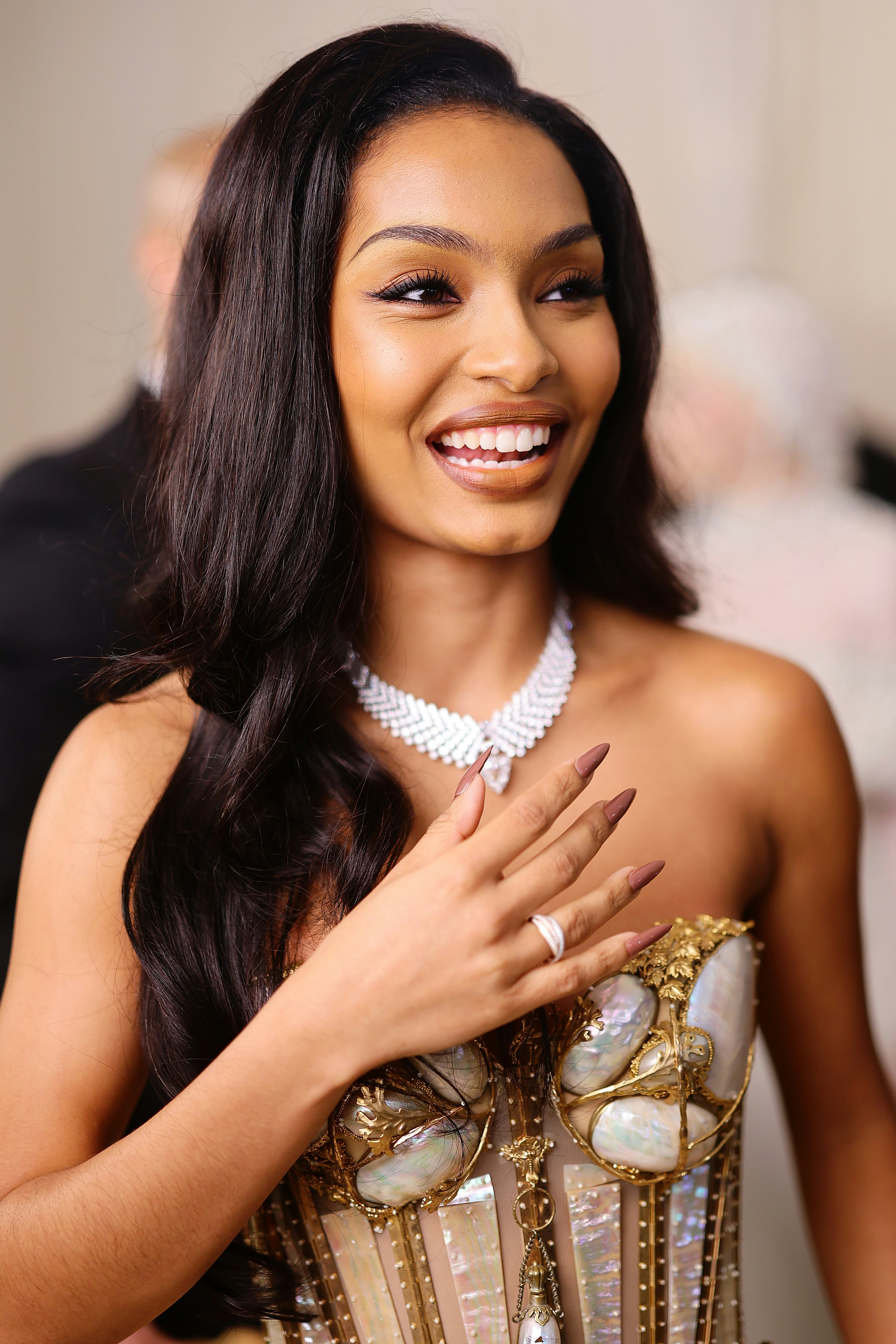 Yara Shahidi wore long light brown stiletto nails for the 2023 Met Gala.