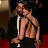 French director Romain Gavras (L) and British singer and model Dua Lipa arrive for the screening of ...