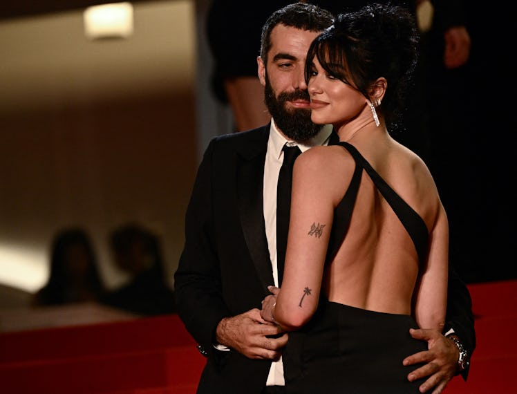 French director Romain Gavras (L) and British singer and model Dua Lipa arrive for the screening of ...