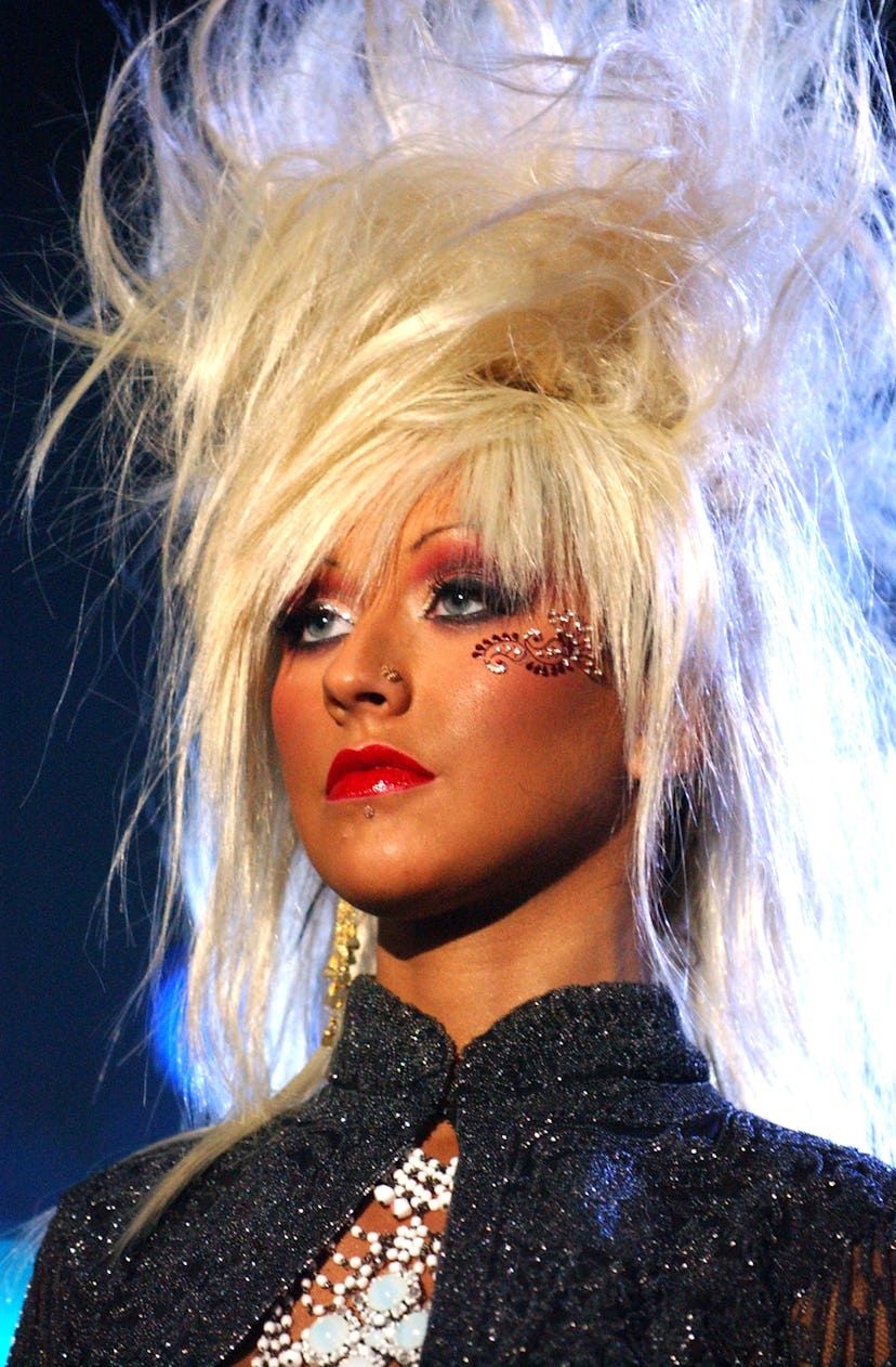 Christina Aguilera performing in Europe with big hair.