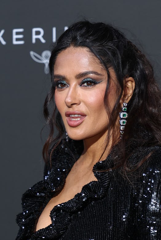 Salma Hayek green makeup and wavy half-ponytail at Cannes 2023