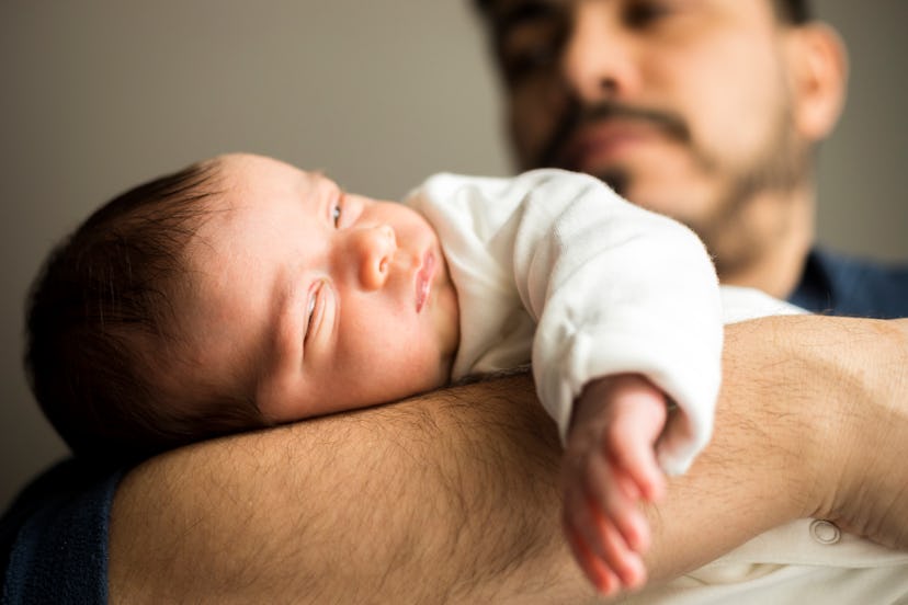 Spooky baby names would fit this baby, dozing off in Dad's arms.