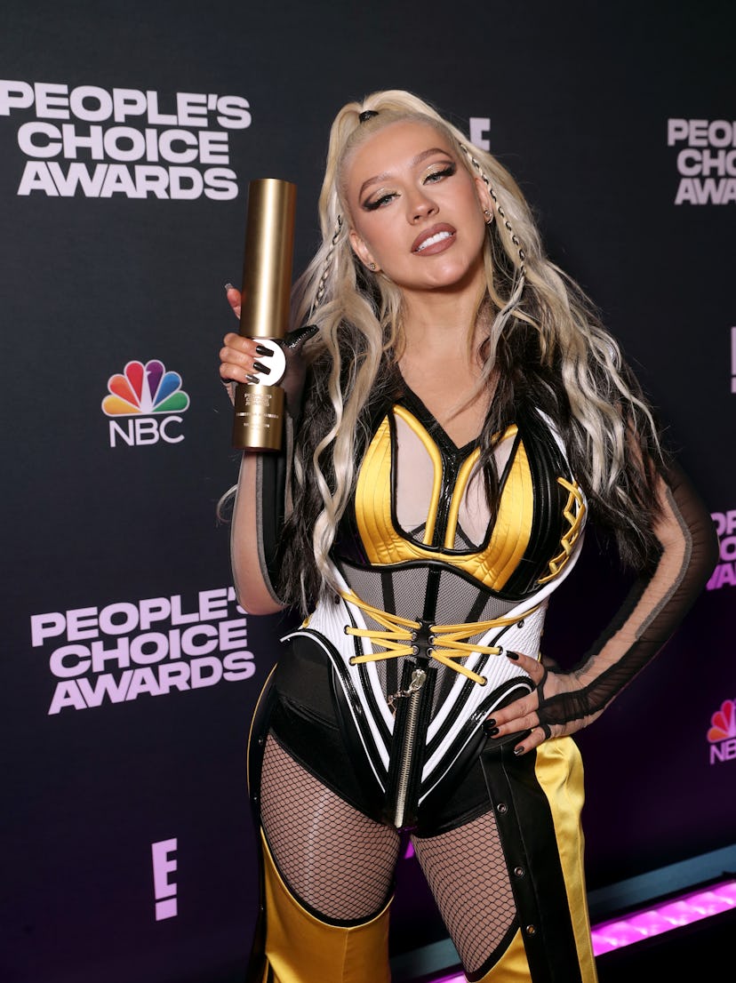 Xtina in 2021 with black and white hair.