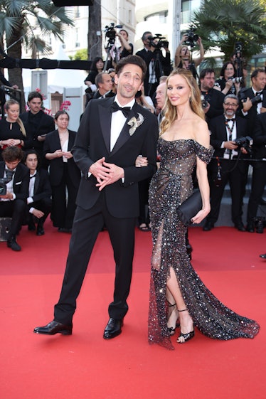 Adrien Brody and Georgina Chapman attends the "Asteroid City" red carpet 