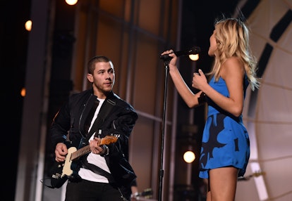 LAS VEGAS, NEVADA - APRIL 01:  Singer/musician Nick Jonas and singer Kelsea Ballerini rehearse onsta...