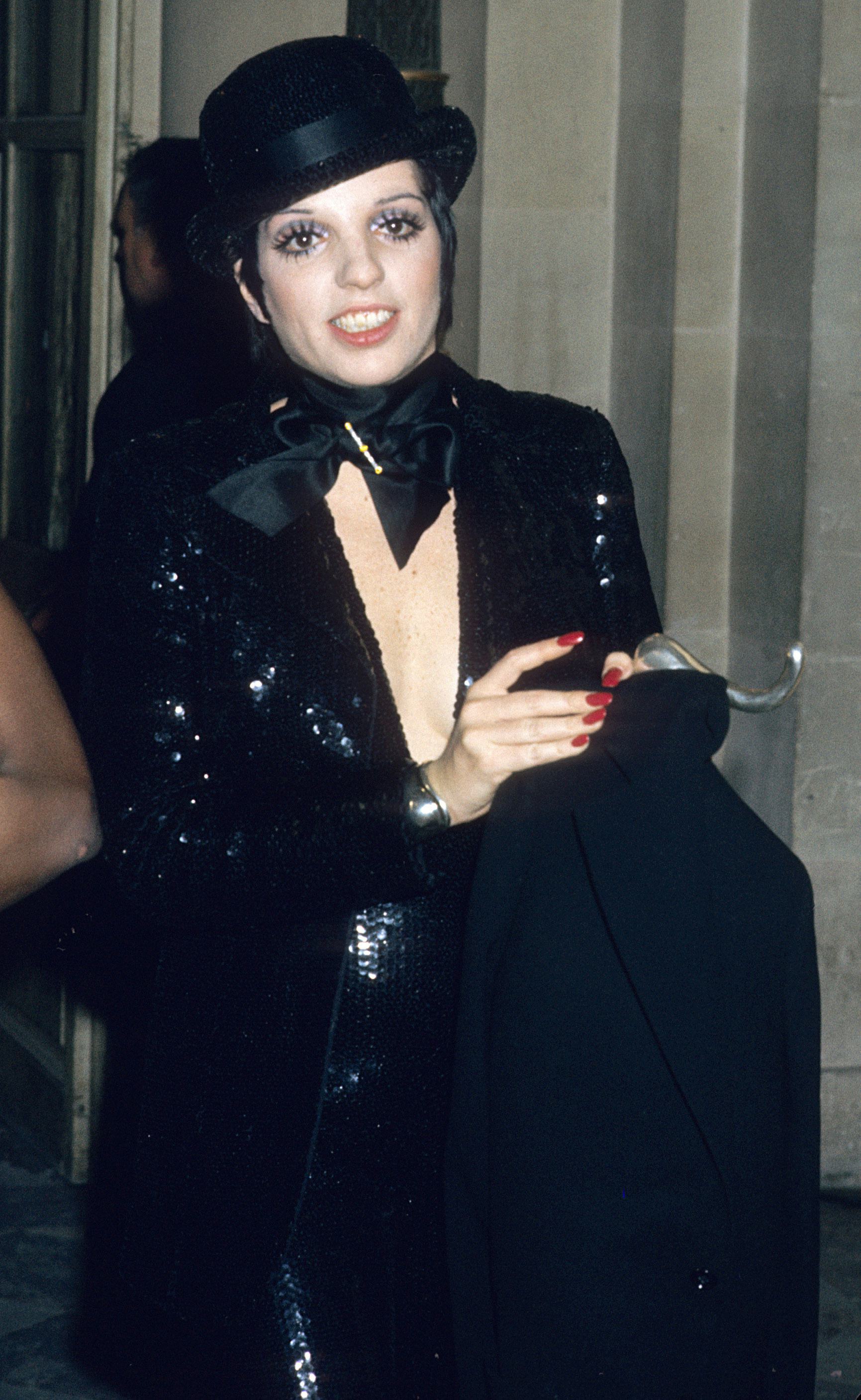 Liza Minnelli wears a sequined outfit with a bowler hat at Palace De Versailles Ball in 1973.