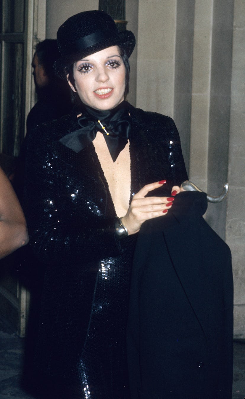 Liza Minnelli wears a sequined outfit with a bowler hat at Palace De Versailles Ball in 1973.