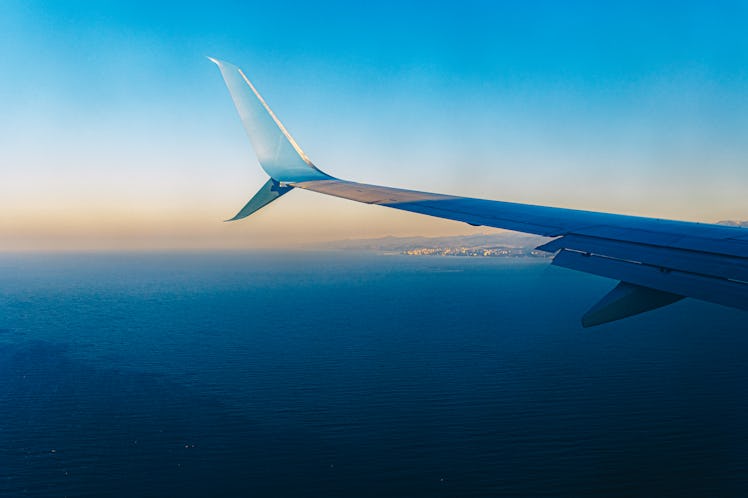 An image of a plane wing in the air.