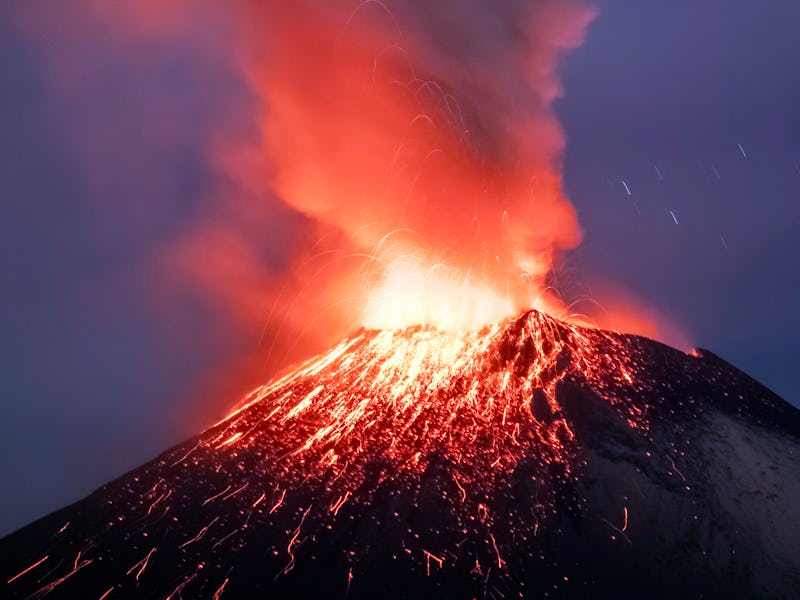 Incandescent materials, ash and smoke are spewed from the Popocatepetl volcano as seen from thr Sant...