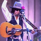 BERKELEY, CA - OCTOBER 9:  Joan Baez performs dressed as Bob Dylan during the Bread & Roses Festival...