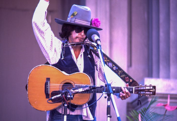 BERKELEY, CA - OCTOBER 9:  Joan Baez performs dressed as Bob Dylan during the Bread & Roses Festival...
