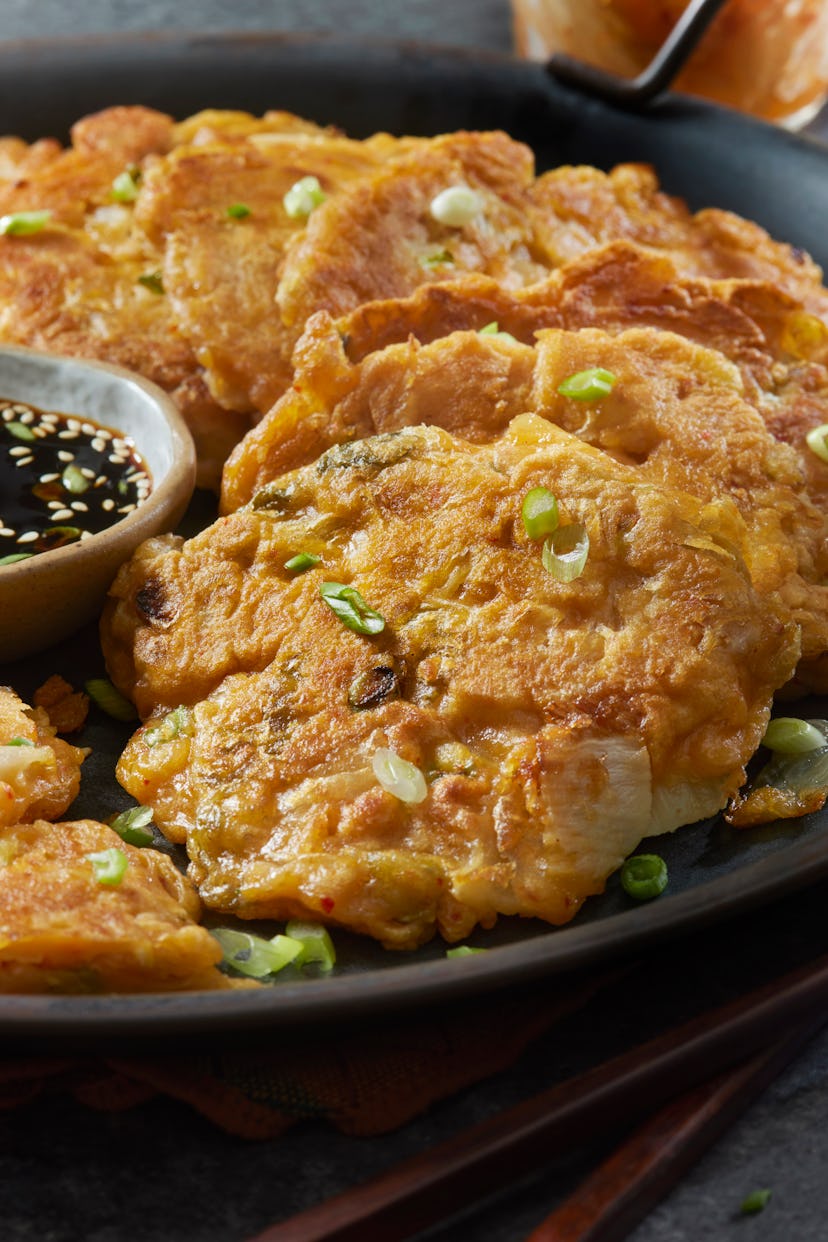 Spicy kimchi pancakes are the appetizer that matches Aries' sign, according to an astrologer.
