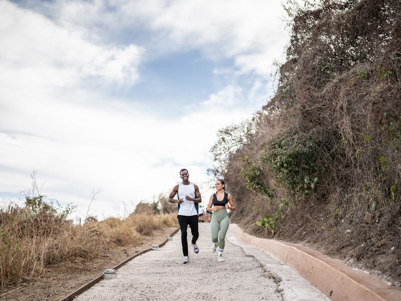 Friends running together outdoors