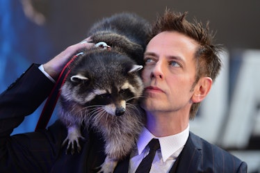 US director James Gunn (R) and a racoon attend the European premiere of the film, Guardians of the G...