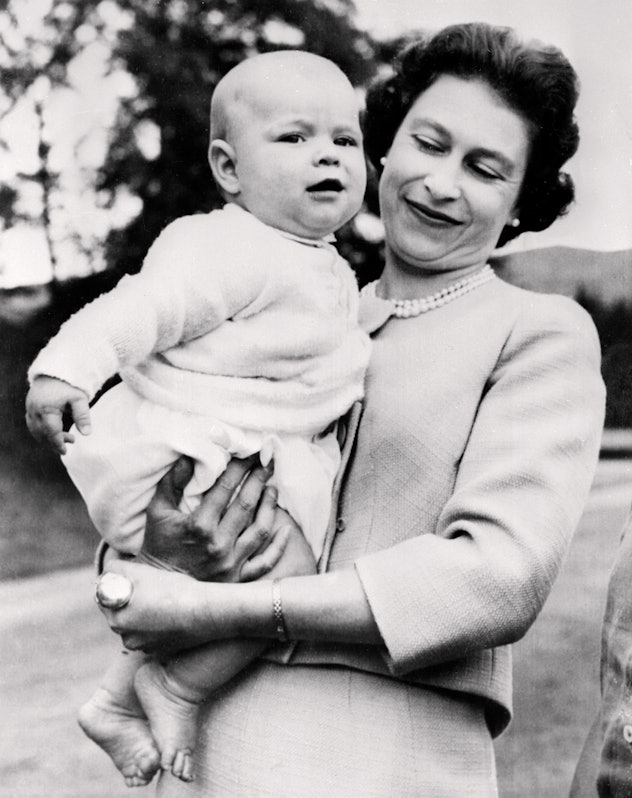 Queen Elizabeth proudly showing off baby Prince Andrew in 1960.