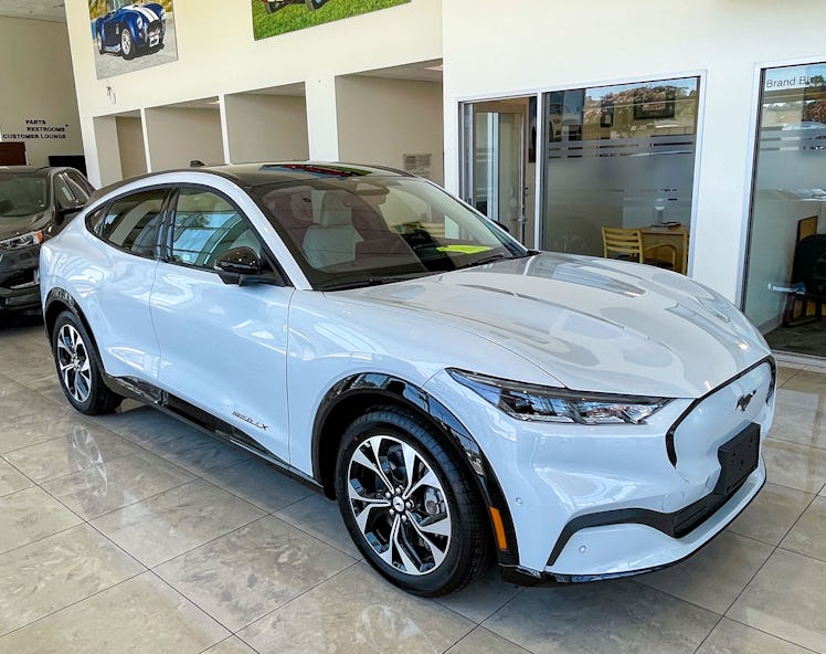 GLENDALE, CA - JUNE 18:  A "sold" Ford Mustang Mach-E SUV crossover electric vehicle sits in the sho...