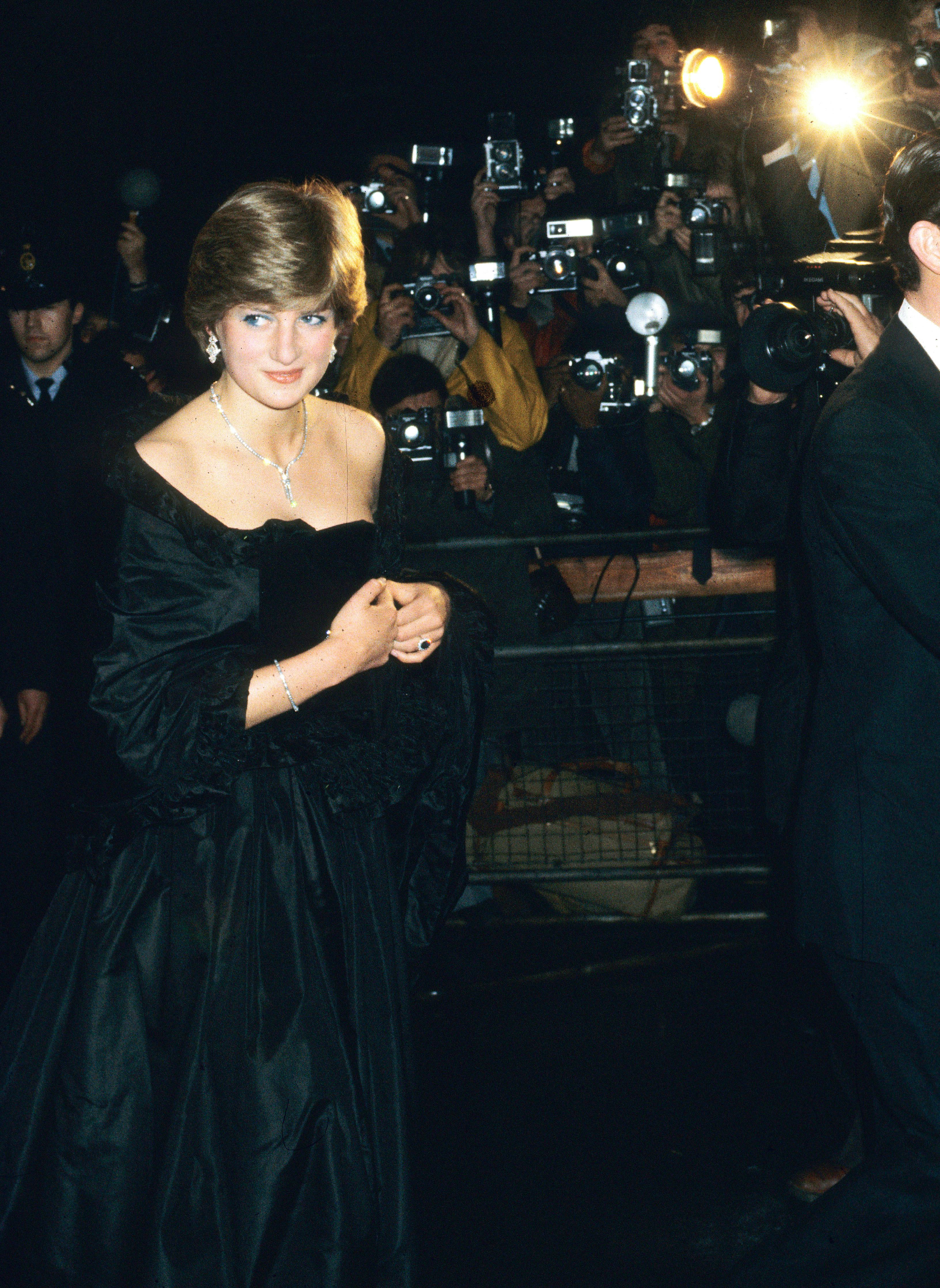 LONDON, ENGLAND - MARCH 09: Lady Diana Spencer, wearing a strapless black taffeta dress designed by &hellip;