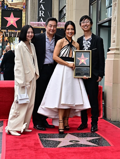 US actress and model Ming-Na Wen poses for a photo with her husband and children during her Hollywoo...