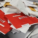 SAN FRANCISCO - MARCH 30:  Red Netflix envelopes sit in a bin of mail at the U.S. Post Office sort c...