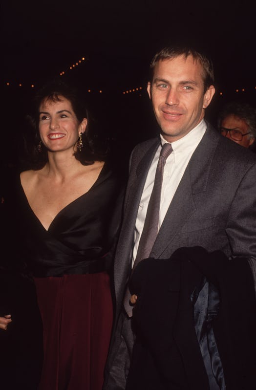 circa 1992:  American actor Kevin Costner and his wife, Cindy Silva, smile while arriving at a semif...