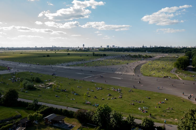 BERLIN, GERMANY - MAY 30: In an aerial view, people relax at Tempelhofer Feld public park during the...
