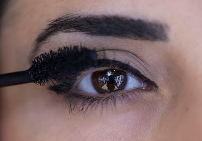ANKARA, TURKEY - SEPTEMBER 04: A photo shows the close-up brown eye of a woman getting her eyelashes...