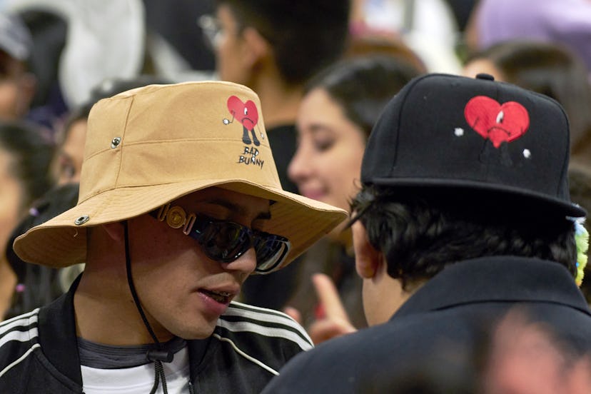 MEXICO CITY, MEXICO - DECEMBER 10: Fans of Bad Bunny wear hat and a cap of Bad Bunny during his seco...