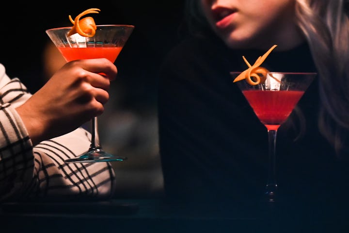 KRAKOW, POLAND - MARCH 28, 2023:
Couple drinking cocktails in a restaurant, on March 28, 2023, in Kr...