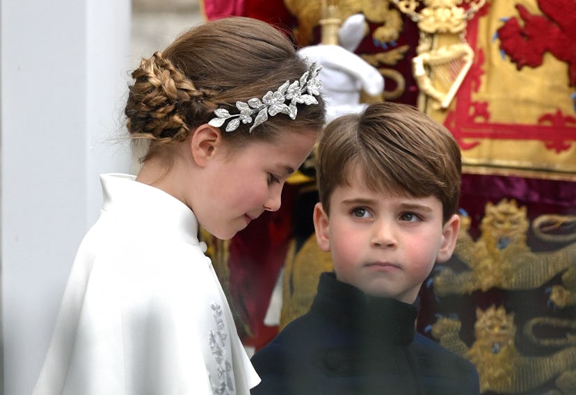 Prince Louis seemed to love Princess Charlotte's floral crown.