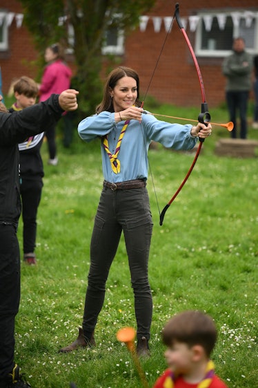 Britain's Catherine, Princess of Wales, tries her hand at archery while taking part in the Big Help ...
