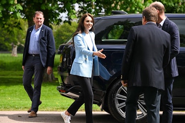 Catherine, Princess of Wales greets people during a walkabout meeting members 