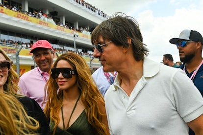 US actor Tom Cruise (R) and Colombian singer Shakira (L) attend the 2023 Miami Formula One Grand Pri...