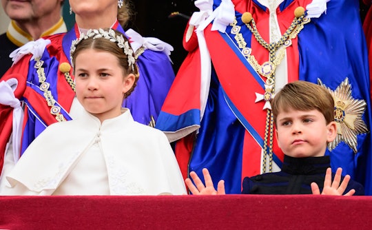TOPSHOT - Britain's Princess Charlotte of Wales and Britain's Prince Louis of Wales stand on the Buc...