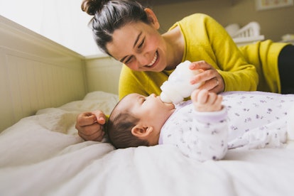 mom and baby having a bottle, in an article about freeze dried breast milk.