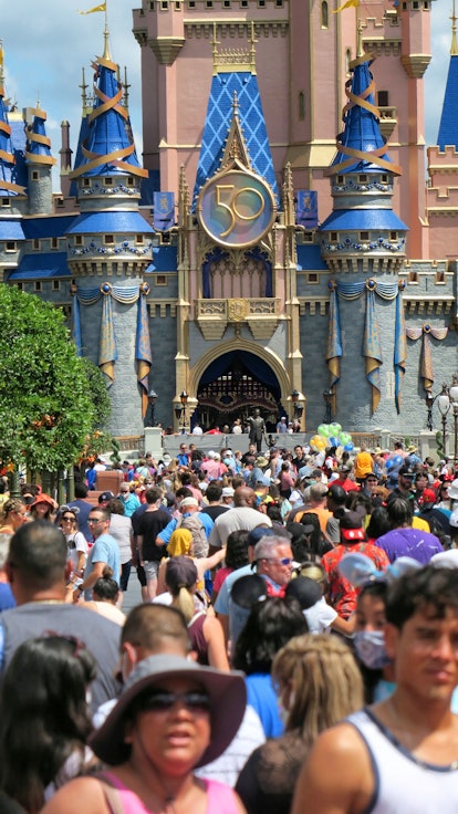 Visitors crowd Main Street USA in the Magic Kingdom at Walt Disney World on Wednesday, August 18, 20...