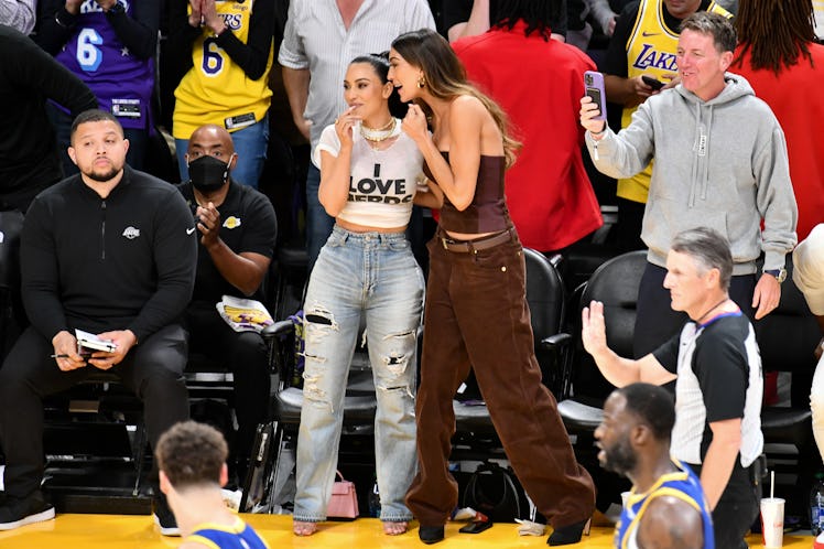  Kim Kardashian (L) and Sarah Staudinger attend a playoff basketball game 