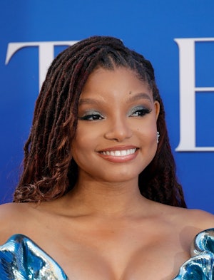 Halle Bailey attends 'The Little Mermaid'  premiere in May 2023 with glam blue eyeshadow.