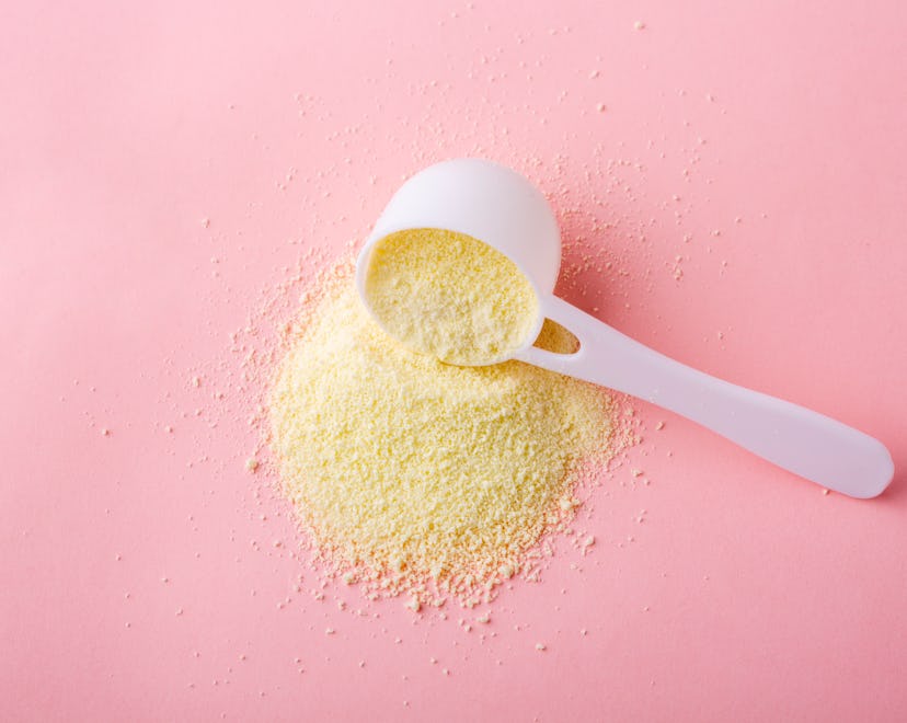 powdered baby formula on a pink surface, in an article about freeze-dried breast milk