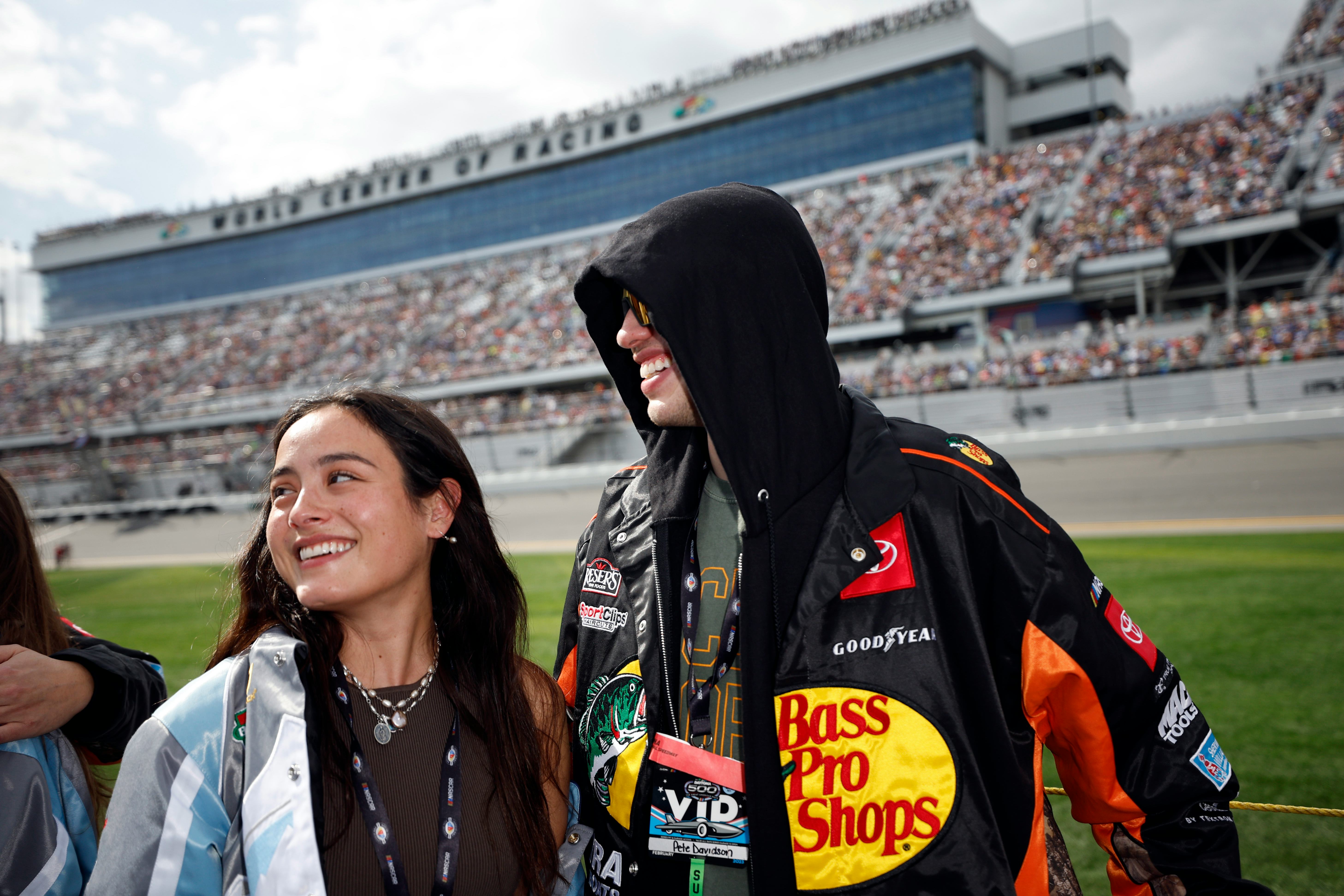 DAYTONA BEACH, FLORIDA - FEBRUARY 19: Pete Davidson and Chase Sui wait on the grid prior to the NASC&hellip;
