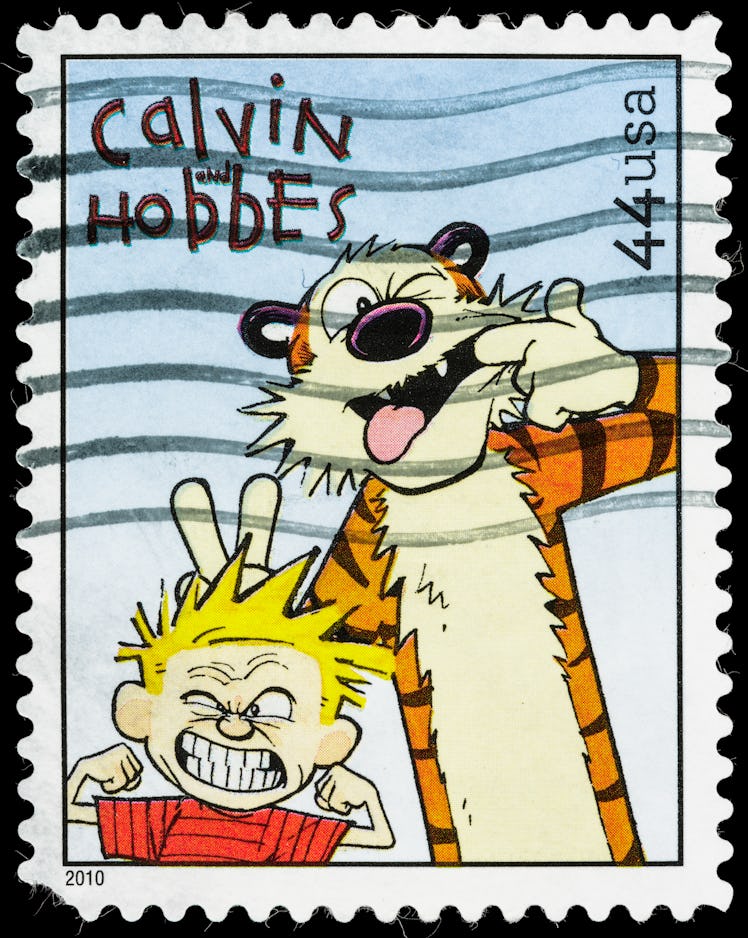 A USA postage stamp of Calvin and Hobbes making funny faces. Calvin is blonde and has a red shirt an...