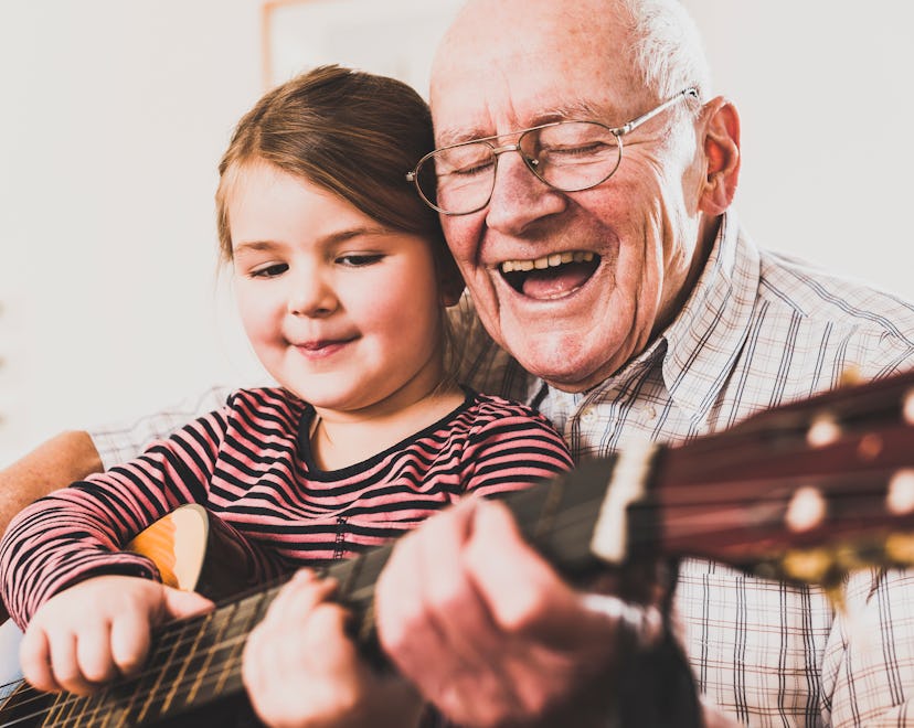 grandfather and granddaughter playing guitar in father's day gifts for grandpa guide