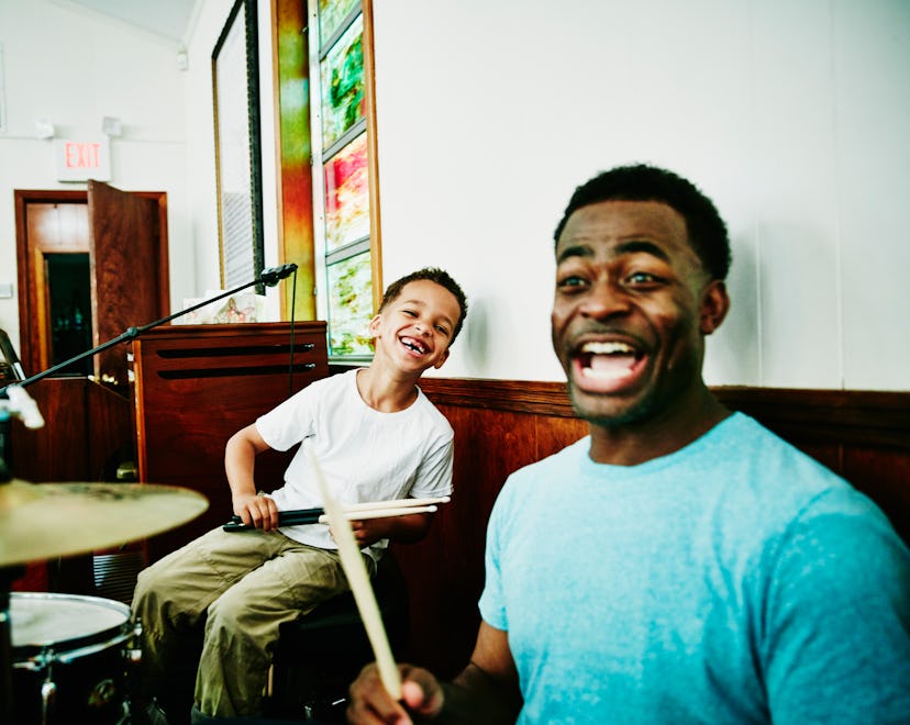 dad and son playing drums and cracking up over funny father's day puns and jokes