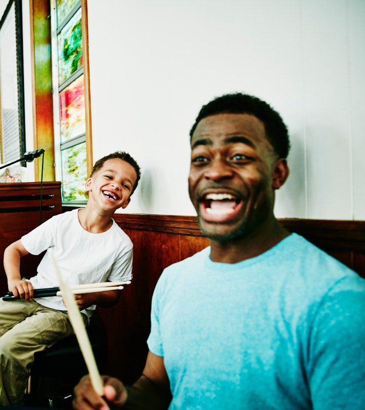 dad and son playing drums and cracking up over funny father's day puns and jokes