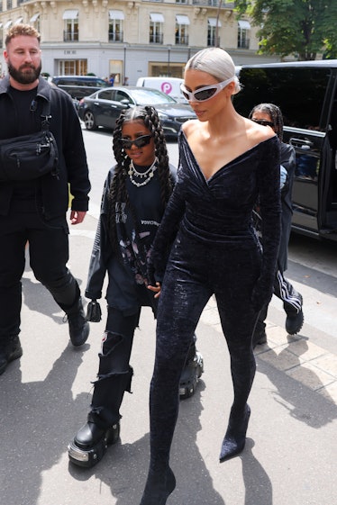 Kim Kardashian and North West arrive at a restaurant  on July 06, 2022 in Paris, France.