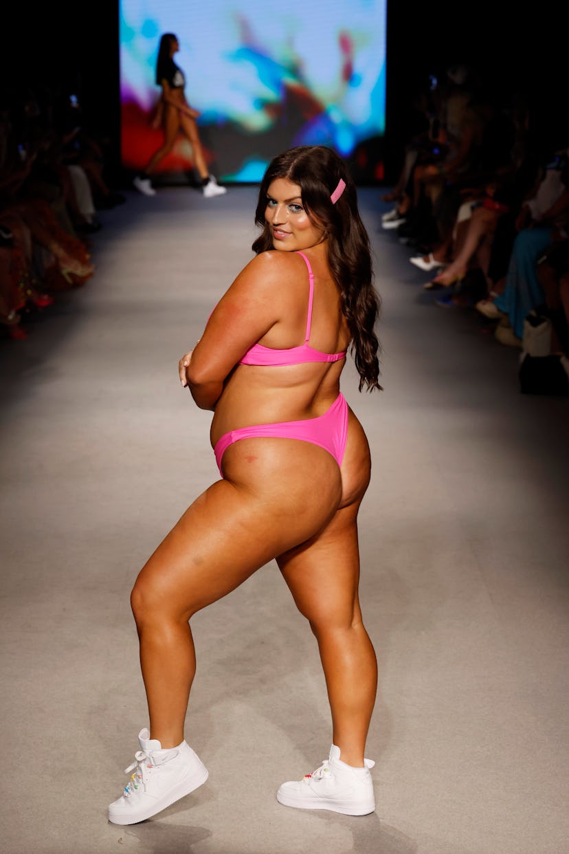 Plus-size model Ella Halikas walks the runway for ONEONE during Paraiso Miami Swim Week 2023 in a th...